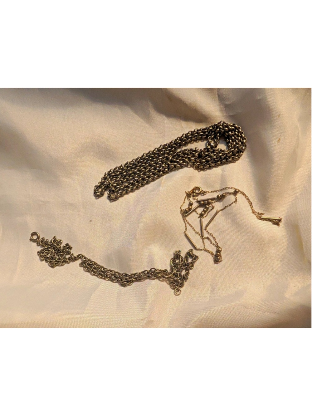 Lot of 3 vintage/older silver-tone necklaces and chains in assorted styles.